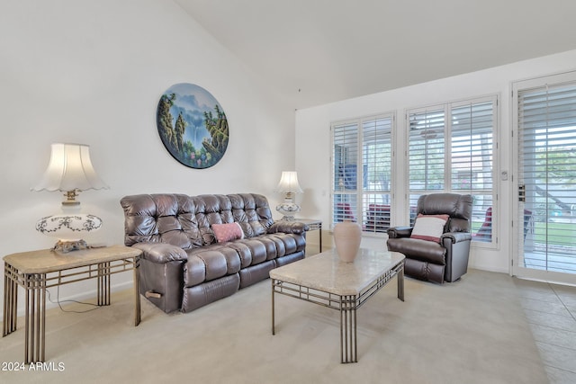 living room featuring lofted ceiling