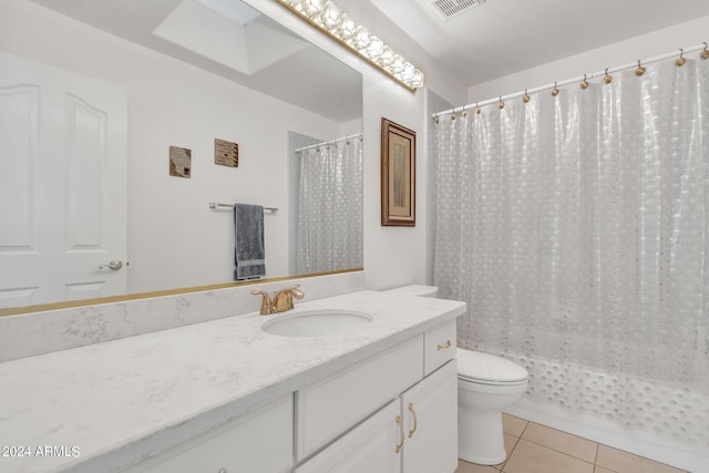 bathroom with vanity, walk in shower, toilet, and tile patterned floors