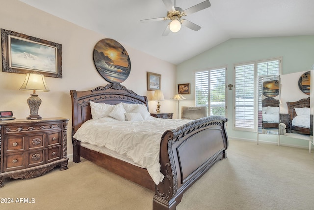 bedroom with ceiling fan, lofted ceiling, and light colored carpet