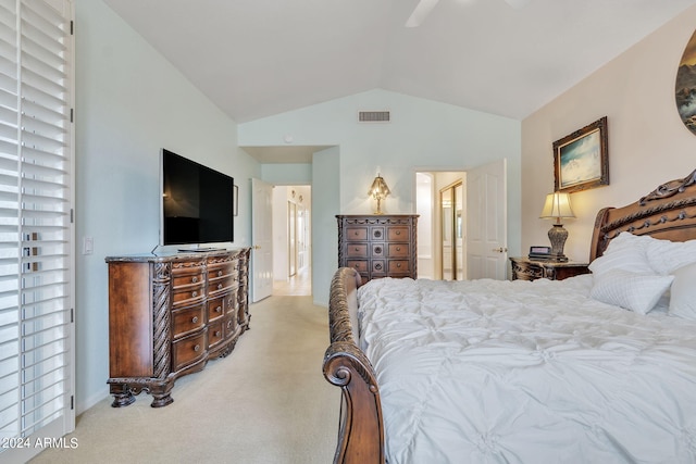 bedroom with vaulted ceiling, light colored carpet, and ceiling fan