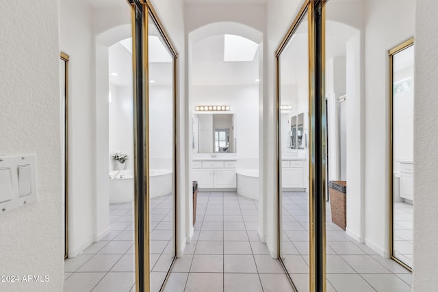 hallway featuring light tile patterned floors