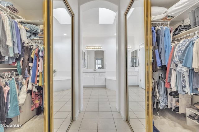 spacious closet with light tile patterned flooring