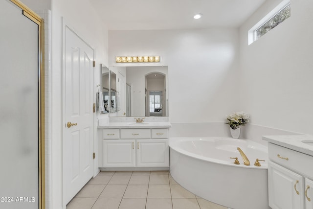 bathroom featuring vanity, independent shower and bath, and tile patterned flooring