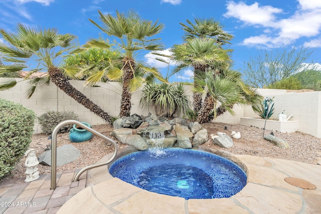 view of pool featuring pool water feature