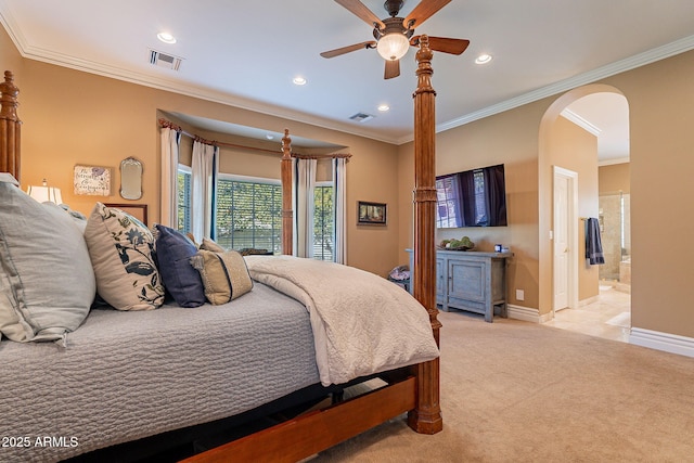 carpeted bedroom featuring connected bathroom and ornamental molding