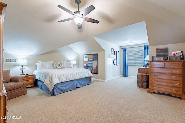 carpeted bedroom with vaulted ceiling and ceiling fan