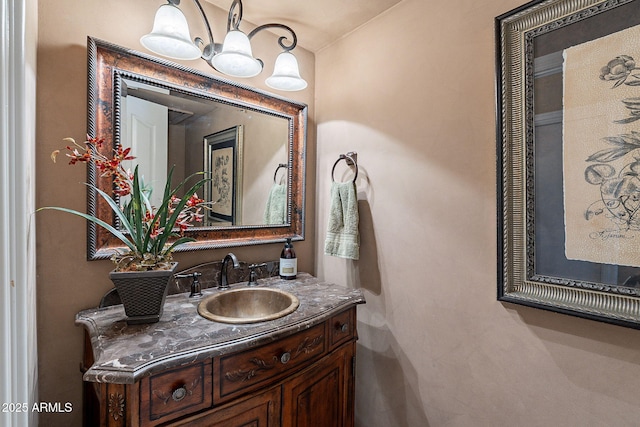 bathroom featuring vanity and a notable chandelier