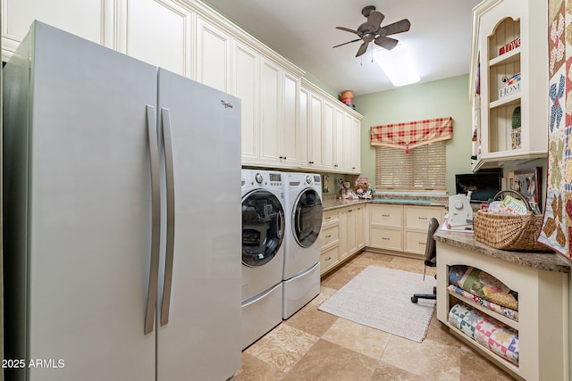 washroom featuring ceiling fan, cabinets, and washer and clothes dryer