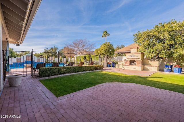 view of patio with an outdoor brick fireplace and a pool