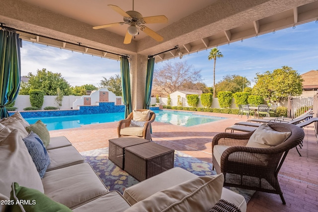 view of pool featuring an outdoor hangout area, ceiling fan, and a patio area