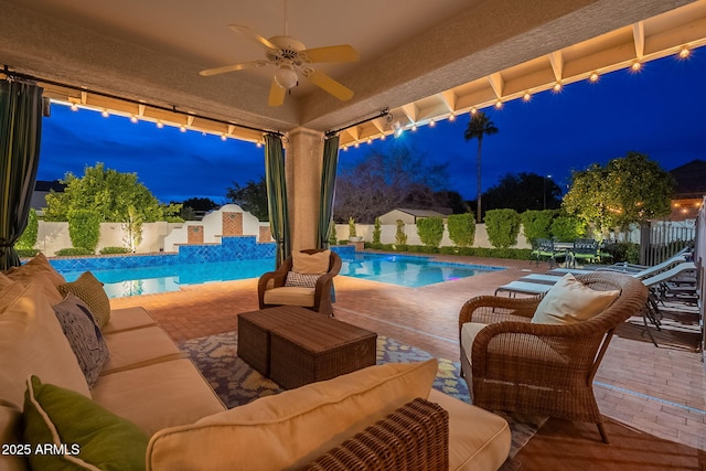 view of pool featuring a patio area, outdoor lounge area, and ceiling fan