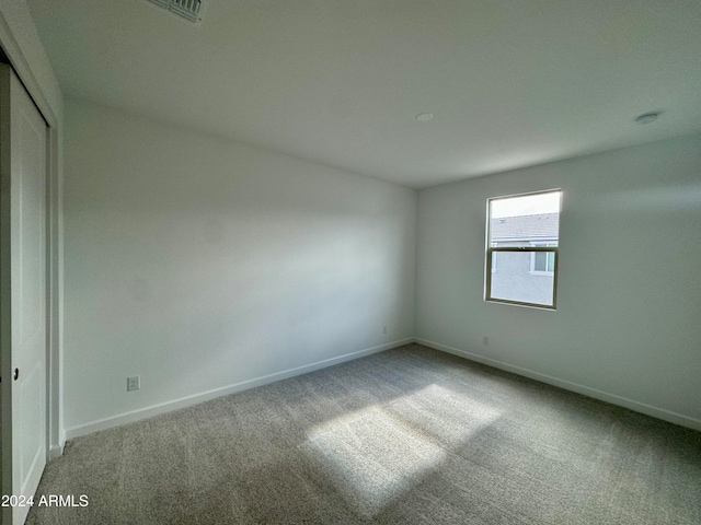 empty room with carpet flooring