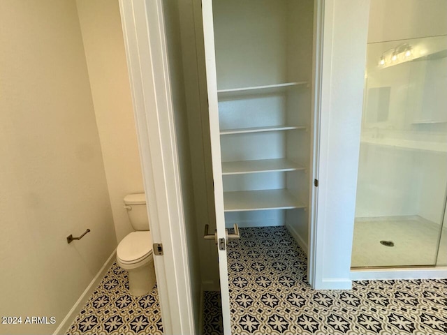 bathroom featuring tile patterned floors and toilet