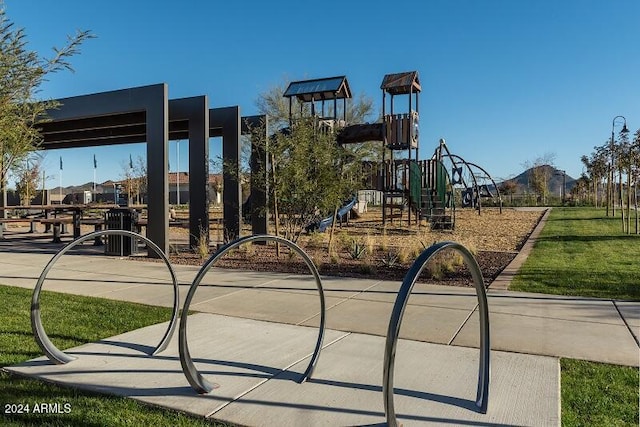 view of jungle gym featuring a lawn