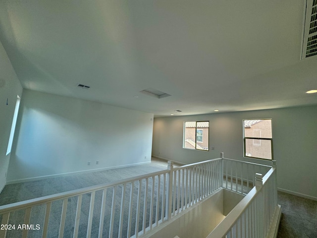 hallway with carpet floors