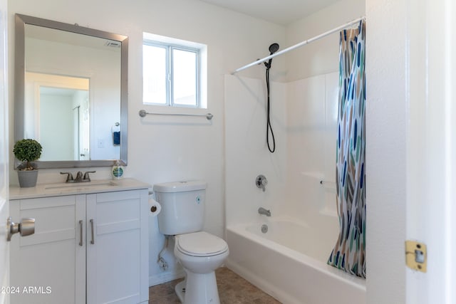 full bathroom with tile patterned floors, shower / bathtub combination with curtain, vanity, and toilet