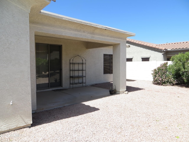 rear view of house featuring a patio