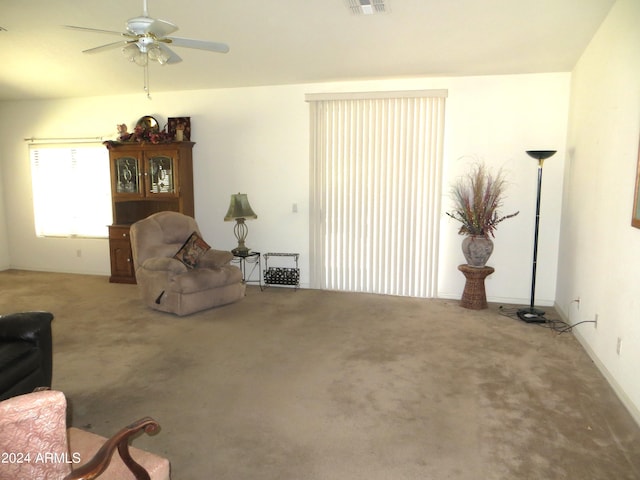 sitting room featuring carpet floors and ceiling fan