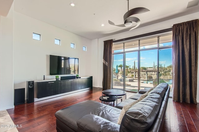 living room with dark hardwood / wood-style floors and ceiling fan