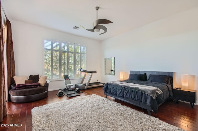 bedroom featuring ceiling fan and dark hardwood / wood-style floors