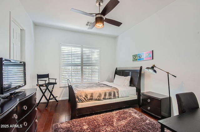 bedroom featuring ceiling fan and dark hardwood / wood-style flooring