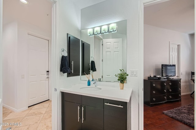 bathroom featuring vanity and hardwood / wood-style flooring