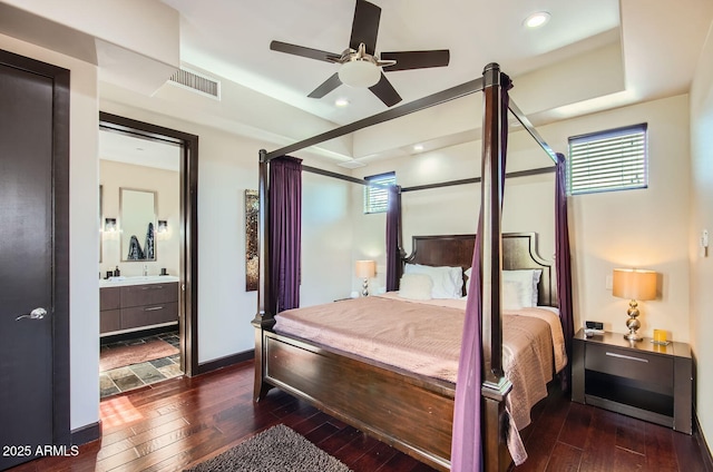 bedroom with ceiling fan, dark hardwood / wood-style flooring, and ensuite bathroom