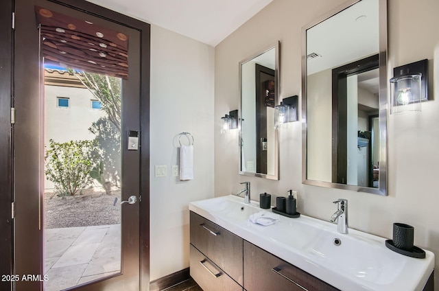 bathroom featuring vanity and a wealth of natural light