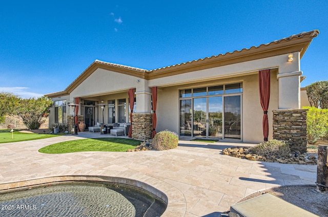 rear view of property with a patio area