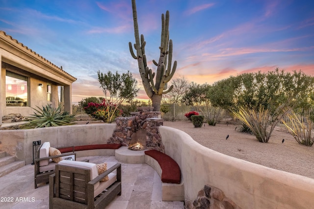 patio terrace at dusk with an outdoor hangout area