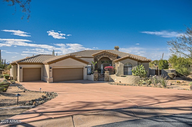 mediterranean / spanish house featuring a garage