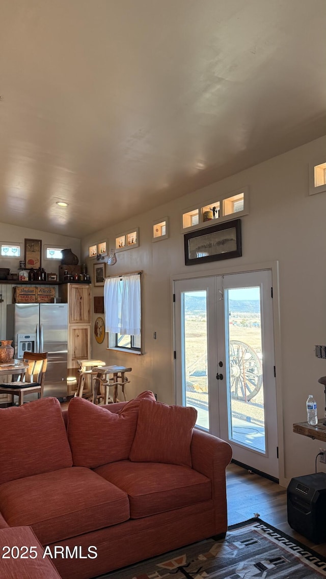 living room with wood finished floors and french doors