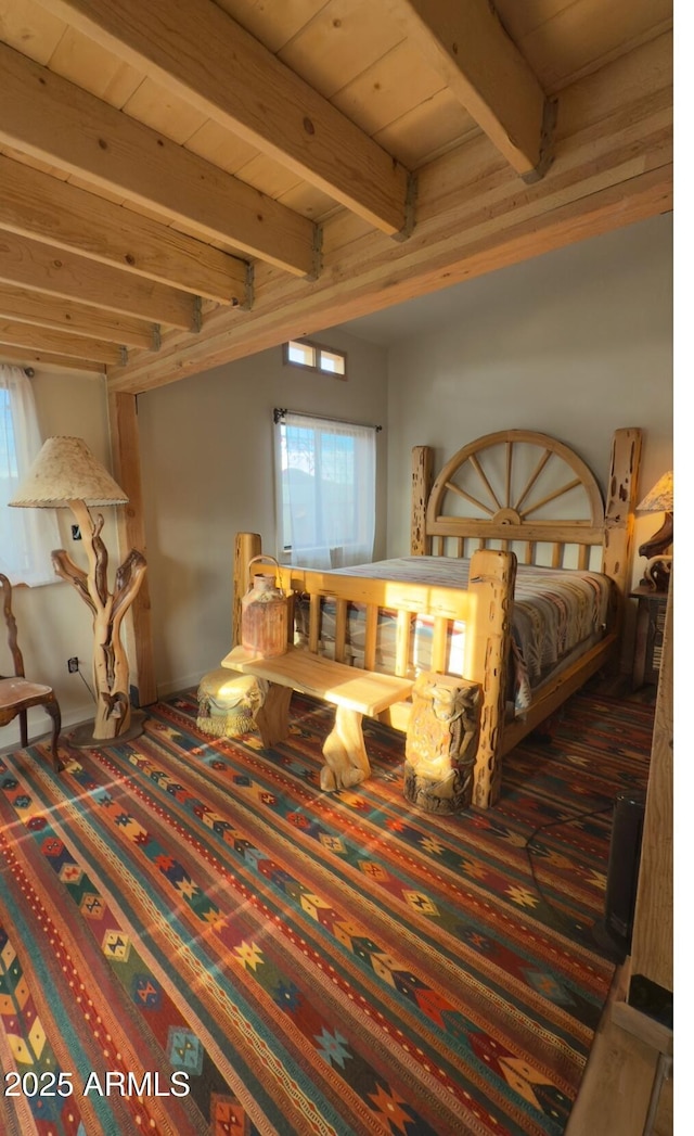 carpeted bedroom with beam ceiling and wood ceiling