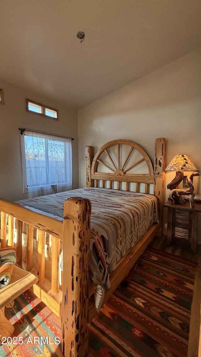 bedroom with wood finished floors