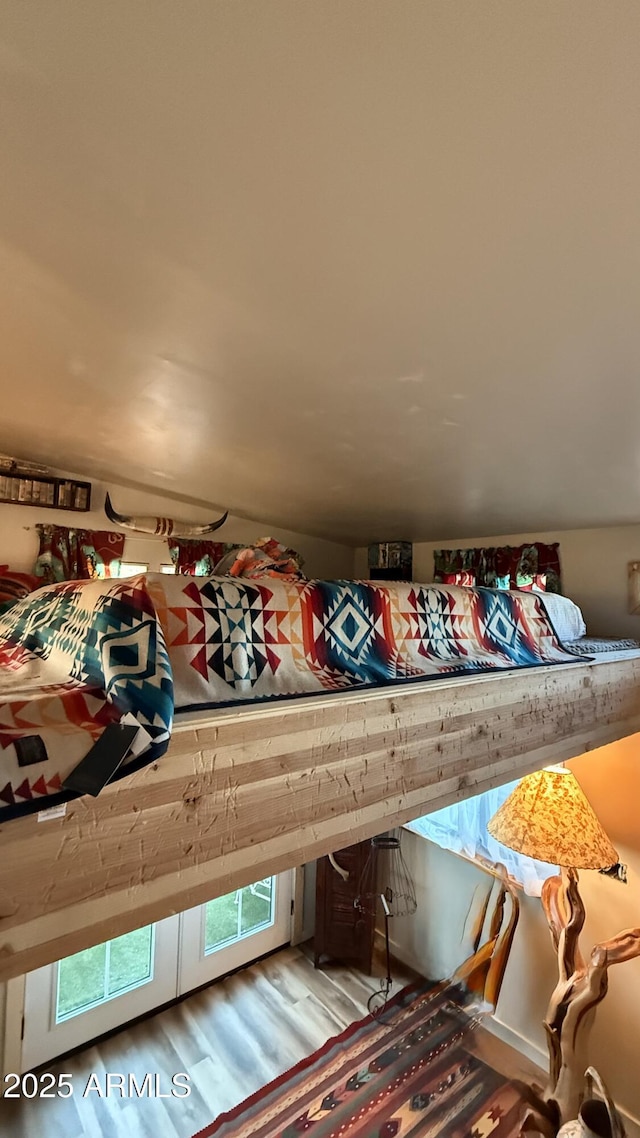 bedroom with wood finished floors