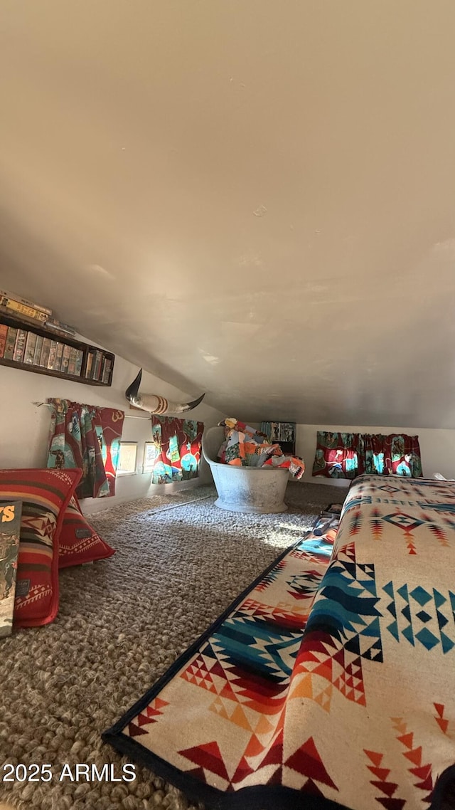 game room with lofted ceiling and carpet