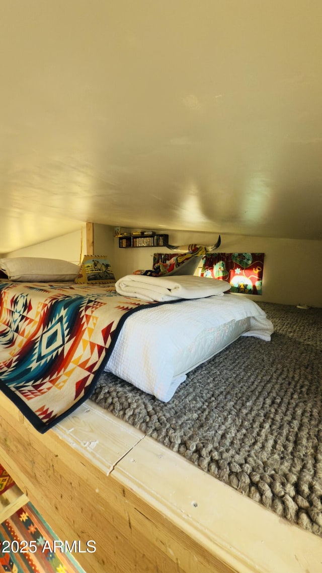 bedroom featuring vaulted ceiling