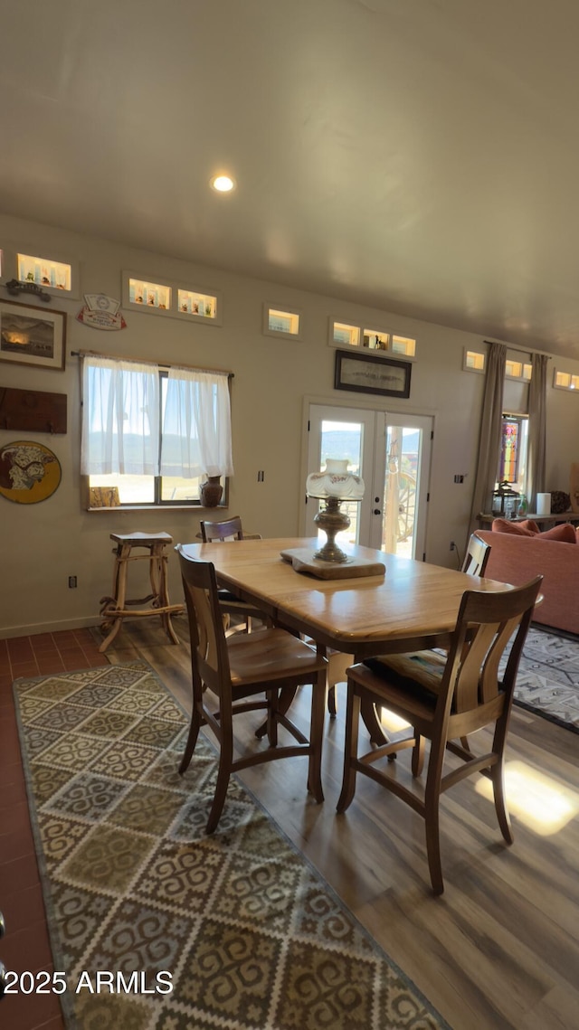 dining area featuring recessed lighting, french doors, and wood finished floors