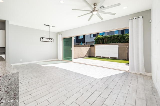view of patio with a ceiling fan and visible vents