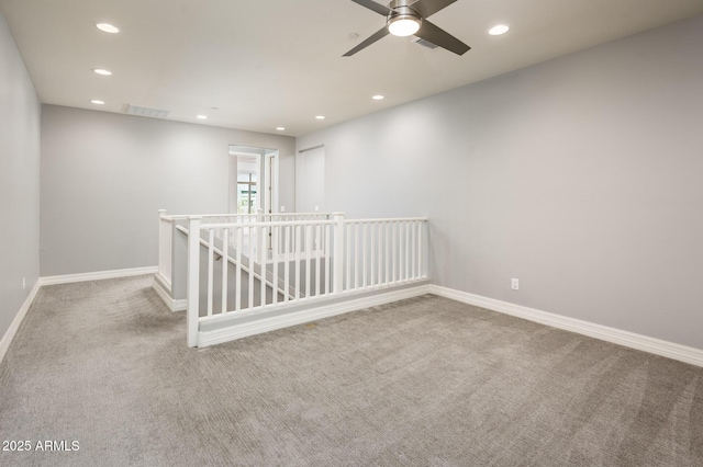 unfurnished room featuring baseboards, recessed lighting, carpet flooring, visible vents, and ceiling fan