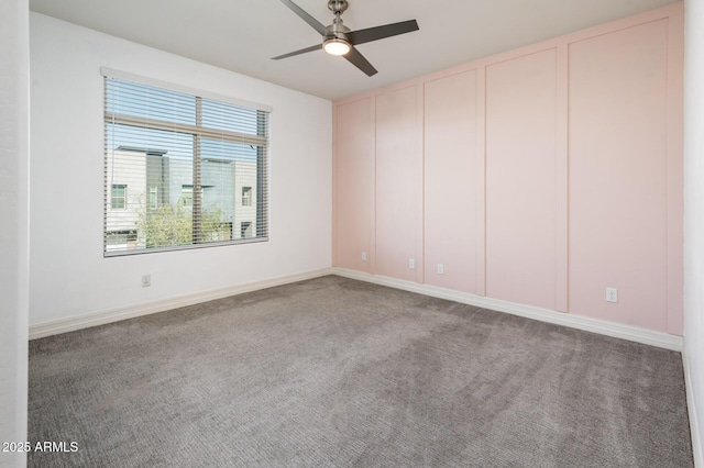 carpeted empty room with ceiling fan