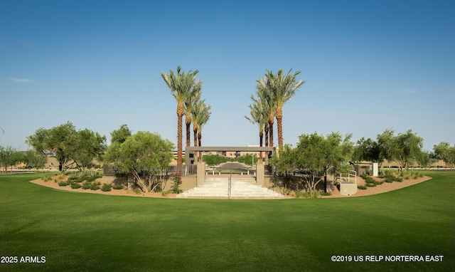 view of home's community with a yard and a patio area