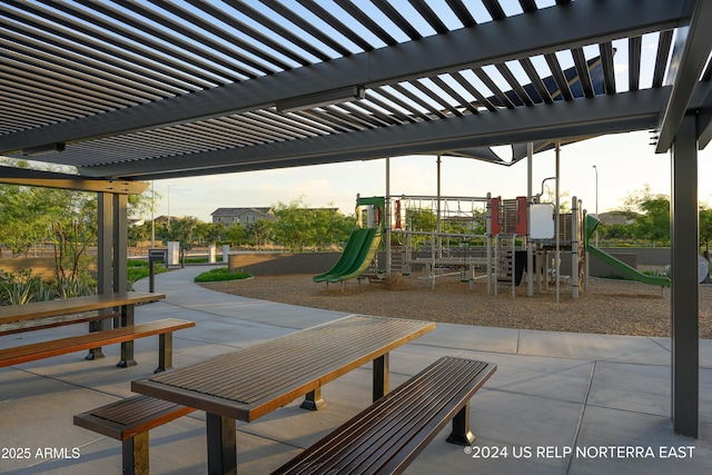 view of patio / terrace featuring playground community and a pergola