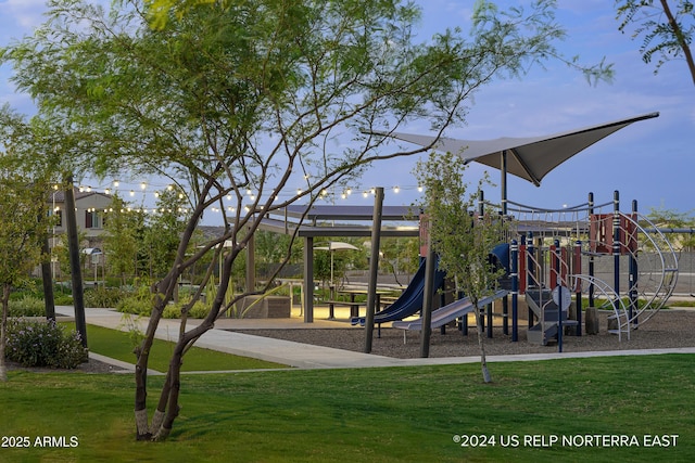 community jungle gym with a lawn