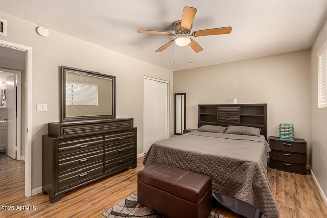 8532 E Portland St, Scottsdale, AZ 85257 - bedroom with light wood finished floors, ceiling fan, and a closet