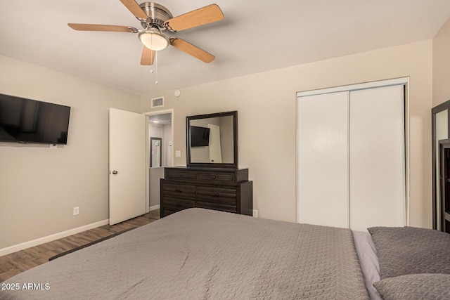8532 E Portland St, Scottsdale, AZ 85257 - bedroom featuring wood finished floors, a closet, and a ceiling fan