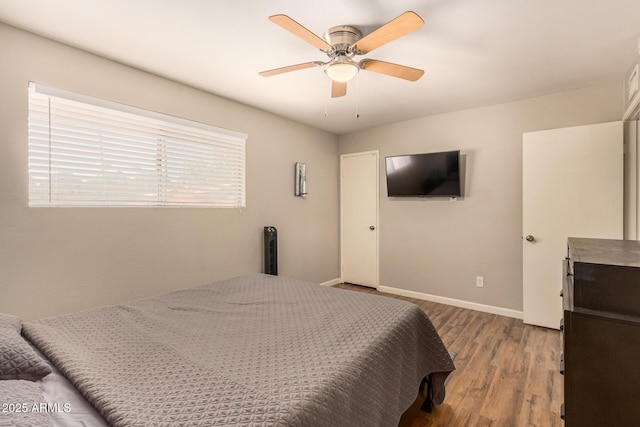8532 E Portland St, Scottsdale, AZ 85257 - bedroom featuring wood finished floors and a ceiling fan