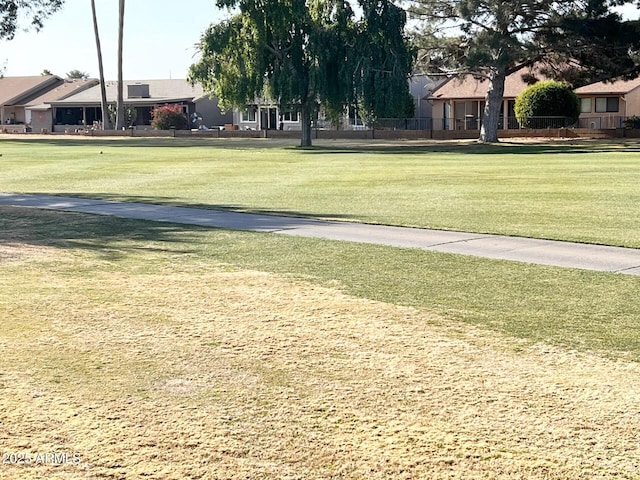 view of home's community featuring a yard