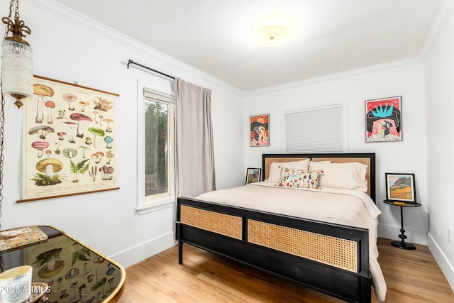 bedroom featuring crown molding and wood-type flooring