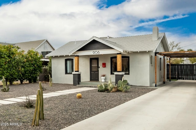 view of front of property with a carport and a porch